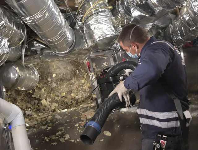 Concord Air Duct Cleaning specialist operating negative pressure cleaning equipment for thorough duct maintenance in Concord