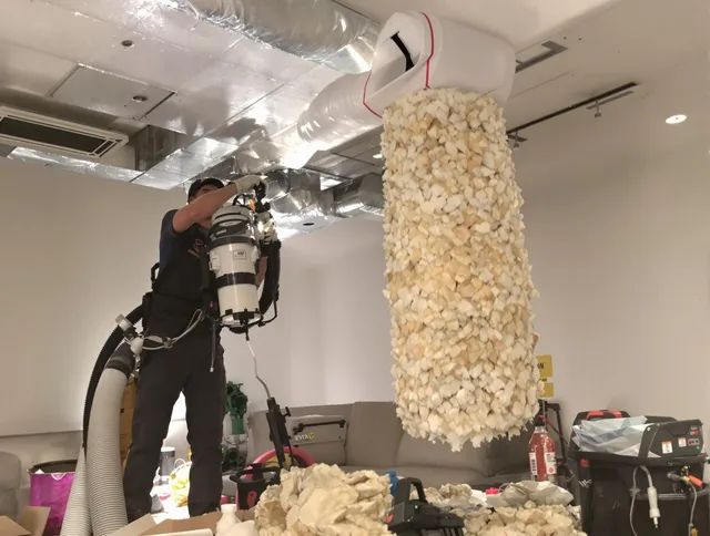 Concord Air Duct Cleaning technician performing precision vacuum insulation removal in a residential property in Concord