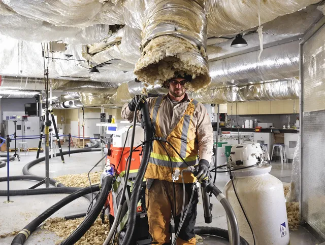 Professional vacuum insulation removal by Concord Air Duct Cleaning expert in Concord
